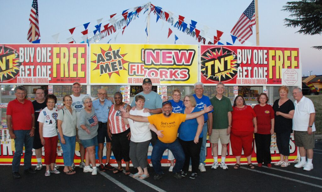 2014 photo of a lot of the fireworks booth volunteers